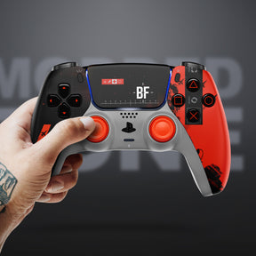 Tattooed hand holding a Battlefield 6-themed custom PlayStation controller with black and orange design and BF logo on the display.