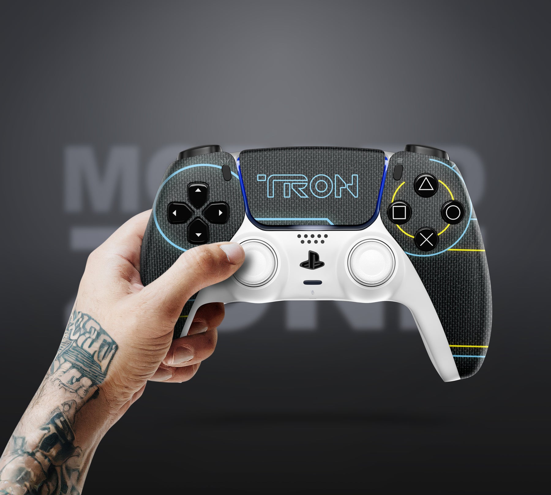 Vibrant gaming controller with 'TRON' design held by a person against a dark background